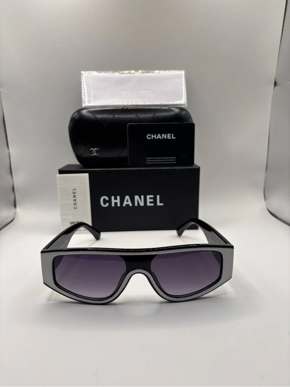 CHANEL Black Shield Sunglasses with Purple Gradient Lenses